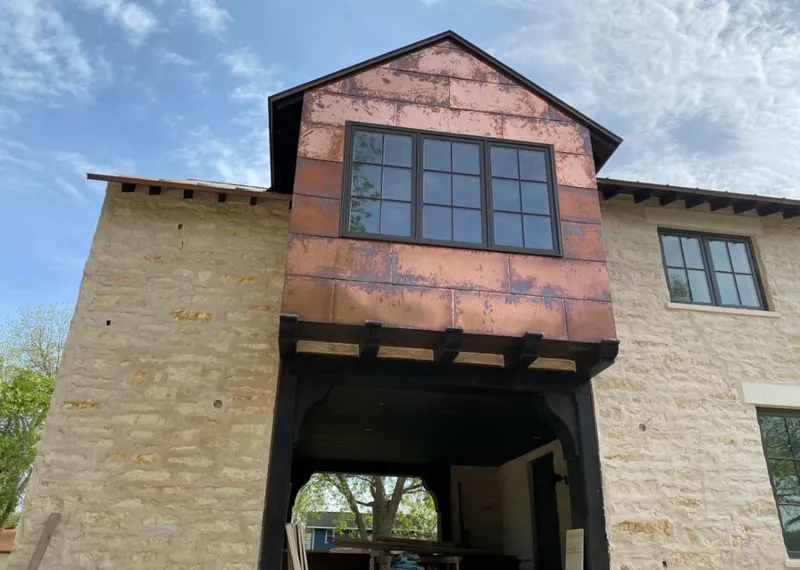 Copper metal panel facade on a stone building for Roof Repair in Hilton Head Island